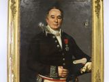 portrait of a man in a military uniform holding a book