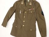 an image of a military jacket on a hanger on a wall