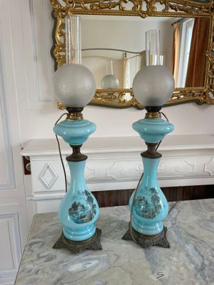 two lamps that are sitting on a marble table