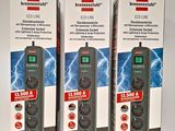 three boxes of power strips sitting next to each other on a table