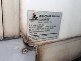 a close up of a sign on a wall near a door
