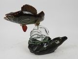 a fish that is sitting on top of a glass object