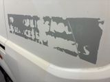 a white van with a sticker on the side of it
