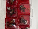 a lot of small plastic toys in a red case