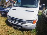 a white van that is parked in the grass