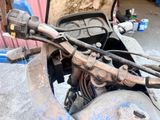a close up of a motorcycle handlebars and a motorbike