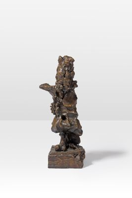 a bronze statue of a boy with a bird on his arm