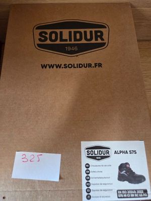 a box with a pair of shoes in it on a table