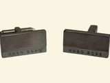 two silver cufflinks with the words hugo boss and hugo boss written on them