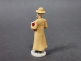 a figurine of a woman with a book in her hand