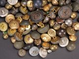 a pile of buttons that are on a table