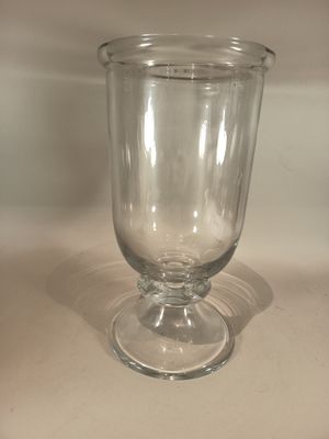 a clear glass vase sitting on a table
