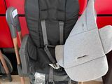 a stroller with a seat that has a bag attached to it