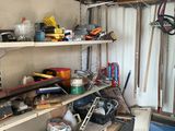 a garage with a lot of tools and tools on the shelves