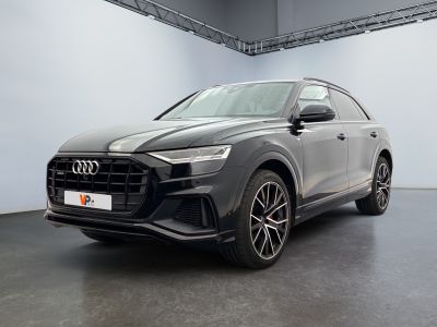 a grey audi q4 parked in a garage