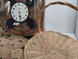 a wicker basket with a clock in the background