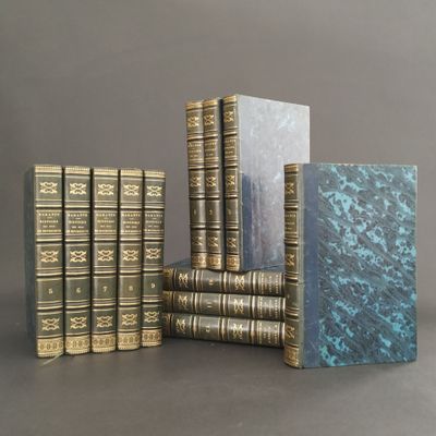 several books are stacked on top of each other on a table
