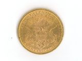 a gold coin on a white surface with a white background