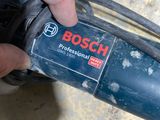 someone is using a bosch cordless sander to polish a piece of wood