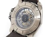 a close up of a watch on a white surface