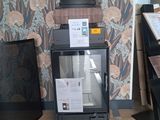 a stack of boxes sitting on top of a stove