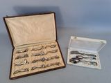 many spoons and spoons in a case on the table