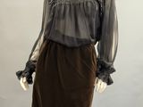 an image of a mannequin wearing a brown skirt and black blouse