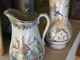 two vases that are sitting on a shelf