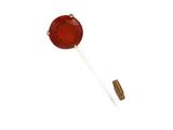a close up of a pin with a red stone on it