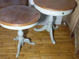 two tables that are sitting on a hard wood floor