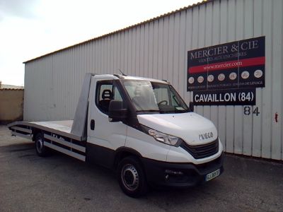 a white truck that is parked in front of a building