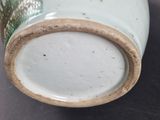 a close up of a vase on a table