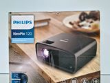 the box of the projector is open on the table