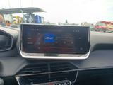 the dashboard of a car with a gps device in the center