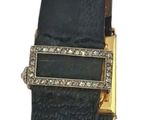 black leather belt with gold buckle on a white background