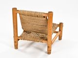 a chair made out of rope and wood on a white background