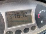 a close up of a digital clock on a car ' s dashboard