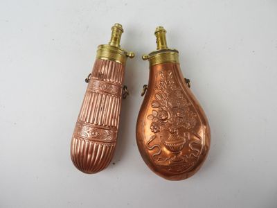 pair of antique copper perfume bottles with ornate designs on them