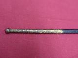 an old baseball bat laying on top of a pink cloth