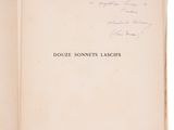 an open book with a handwritten title on the cover