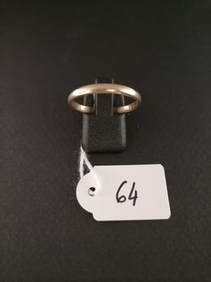 a close up of a gold ring with a price tag on it
