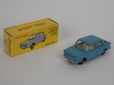 a blue toy car next to a yellow box on a white surface