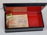 a small box with a ticket in it on a table