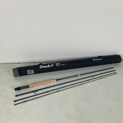 a black and white photo of a fly rod and a fly rod