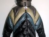 hooded jacket on a mannequin stand against a white wall