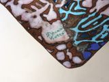 a close up of a heart shaped object with a design on it