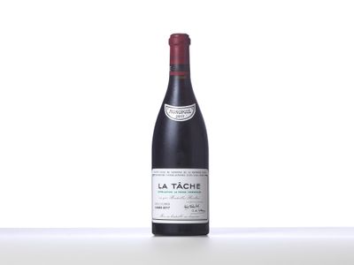 a bottle of red wine sitting on top of a table
