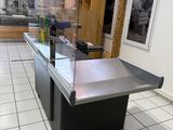 a counter with a glass top in a kitchen