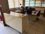 a desk with a laptop on it in a room