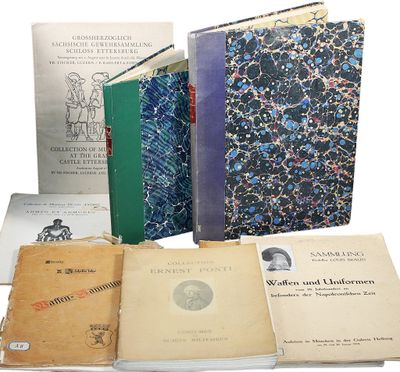 several books are stacked on top of each other on a white surface